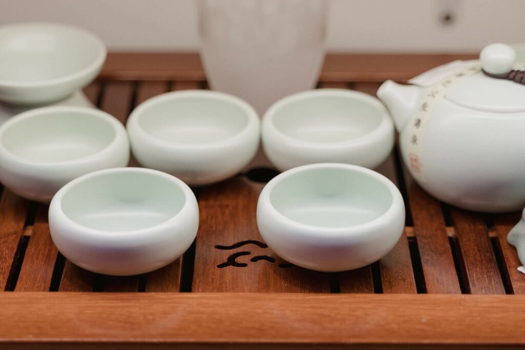Japanese ceramics beautifully arranged on a wooden tray.