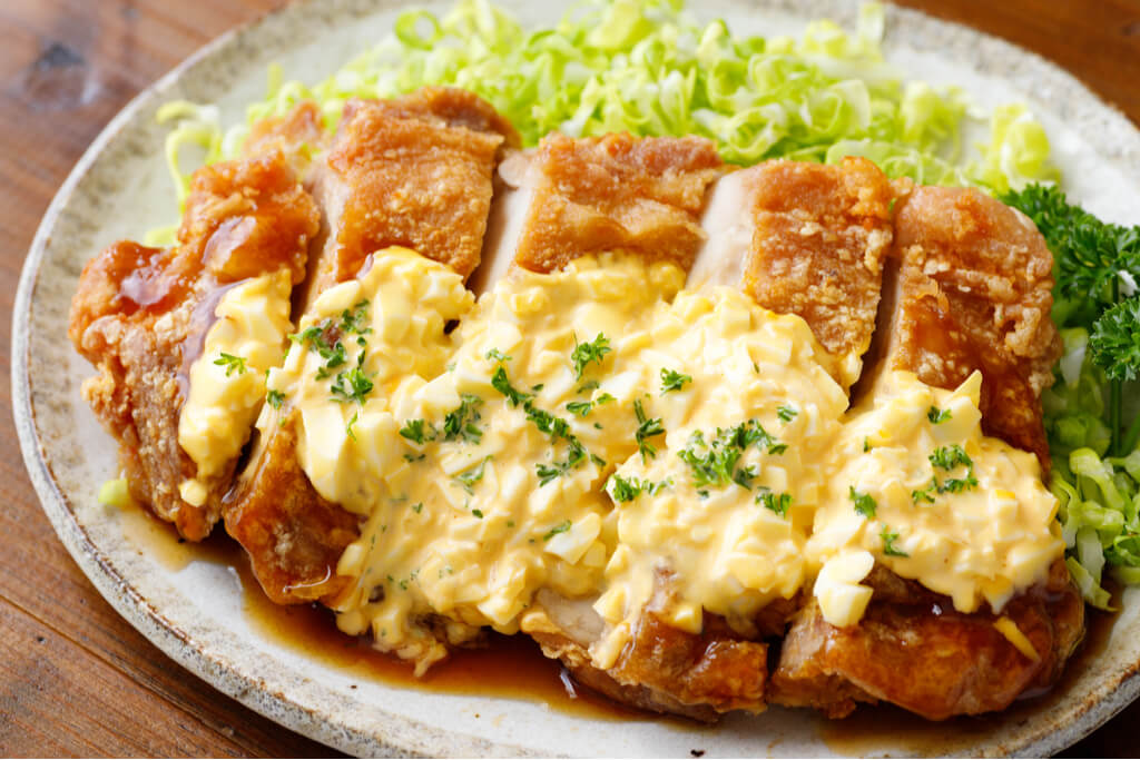 Chicken nanban, a Kyushu local food, on top of cabbage on a plate