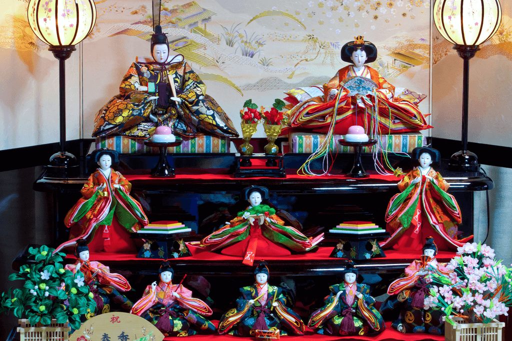 Hina Dolls sit on a special stand in a home for Hinamatsuri, with the prince and princess dolls sitting at the top.
