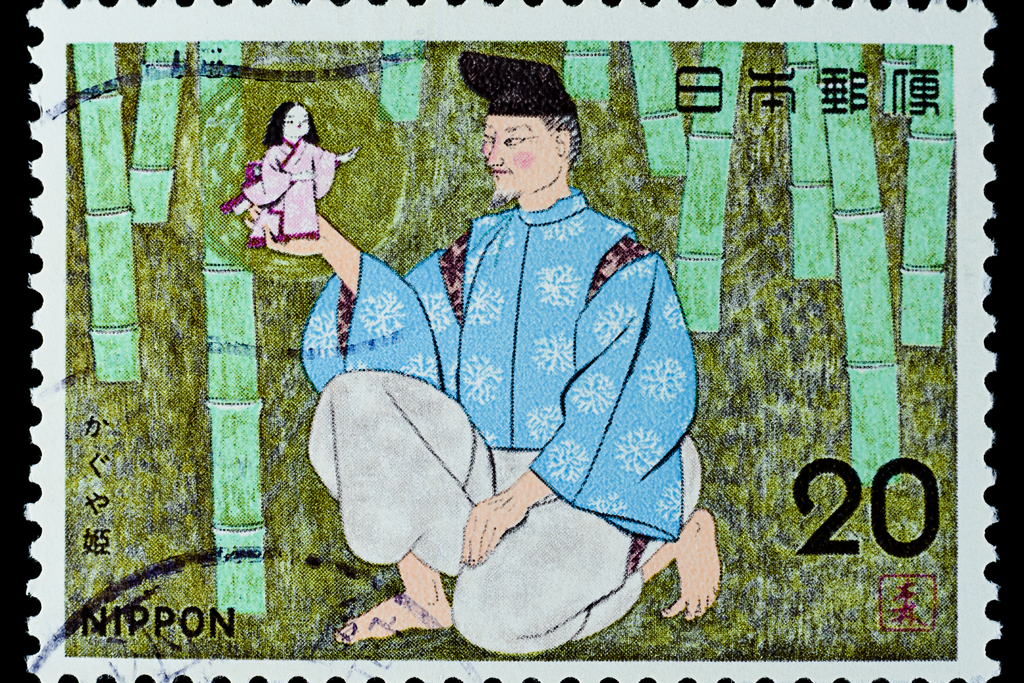 A commerative postal stamp of The Tale of Princesss Kaguya, which depicts an elderly man weating a blue tunic, gray pants and black hat, holding a palm-sized Princess Kaguya, who's wearing a pink kimono.