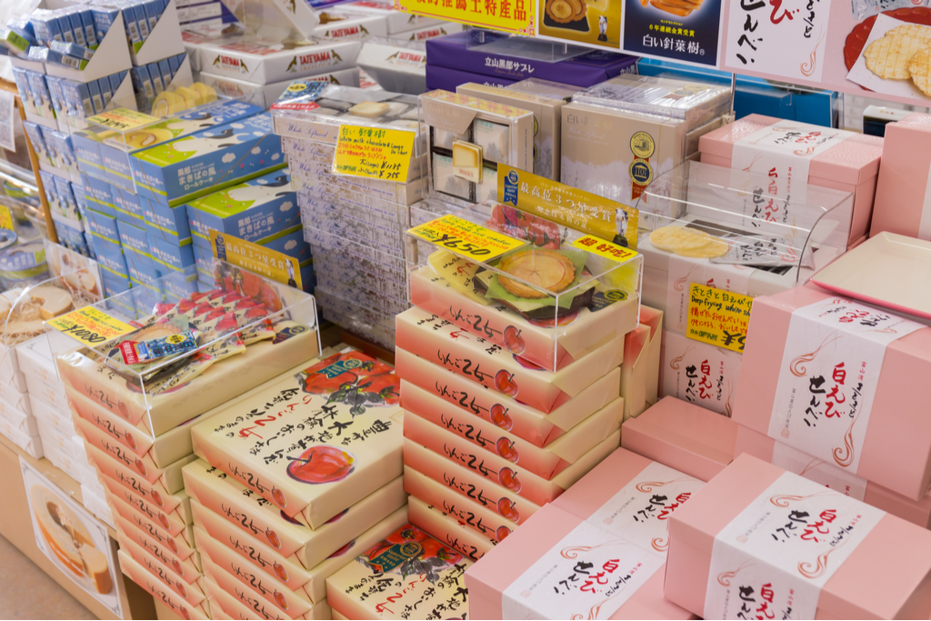 Many souvenir snacks, common option for gift giving in Japan when travelling, with many boxes of snacks like rice crackers, mini apple pies, and more.