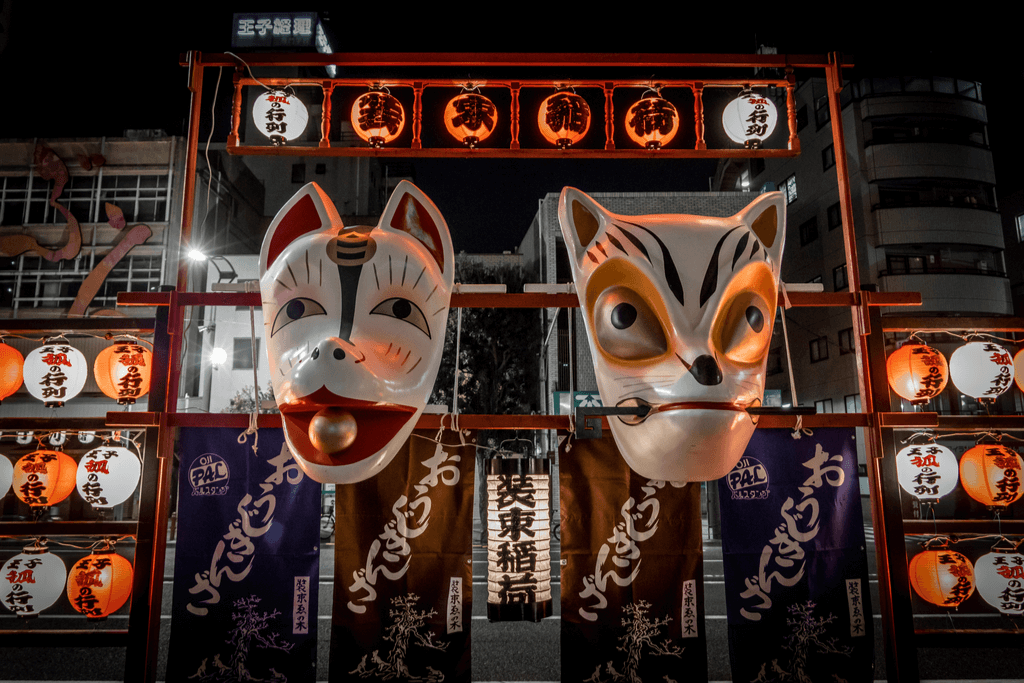 Two kitsune masks in a temple. 