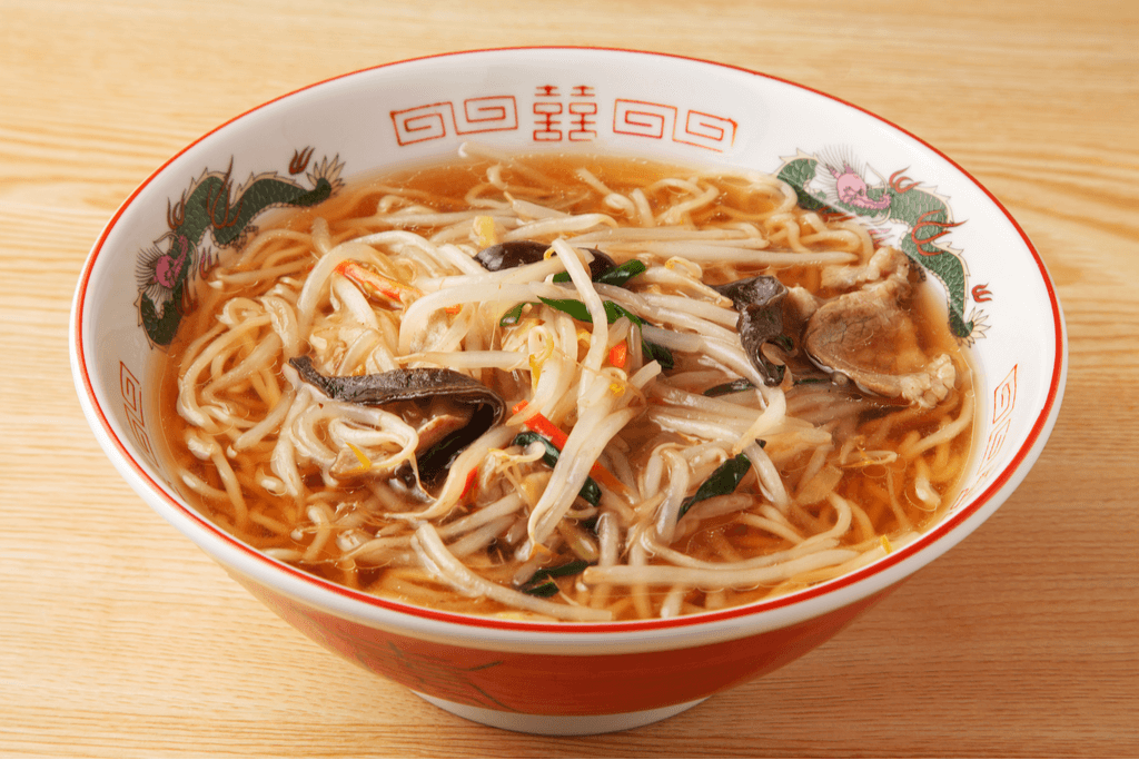 A bowl of Sanmamen, one of the original Yokohama foods, contains beef bits, mushrooms, ramen noodles, and bean sprouts
