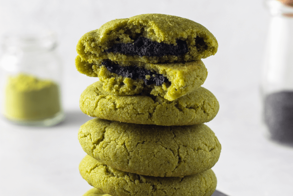 Black sesame stuffed matcha sugar cookies, which are green on the outside and black on the inside.