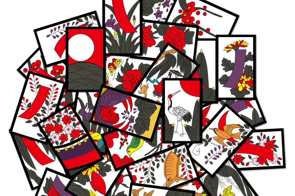 An overhead image of hanafuda cards, which are a type of tradiitonal Japanese playing cards. They are very colorful.