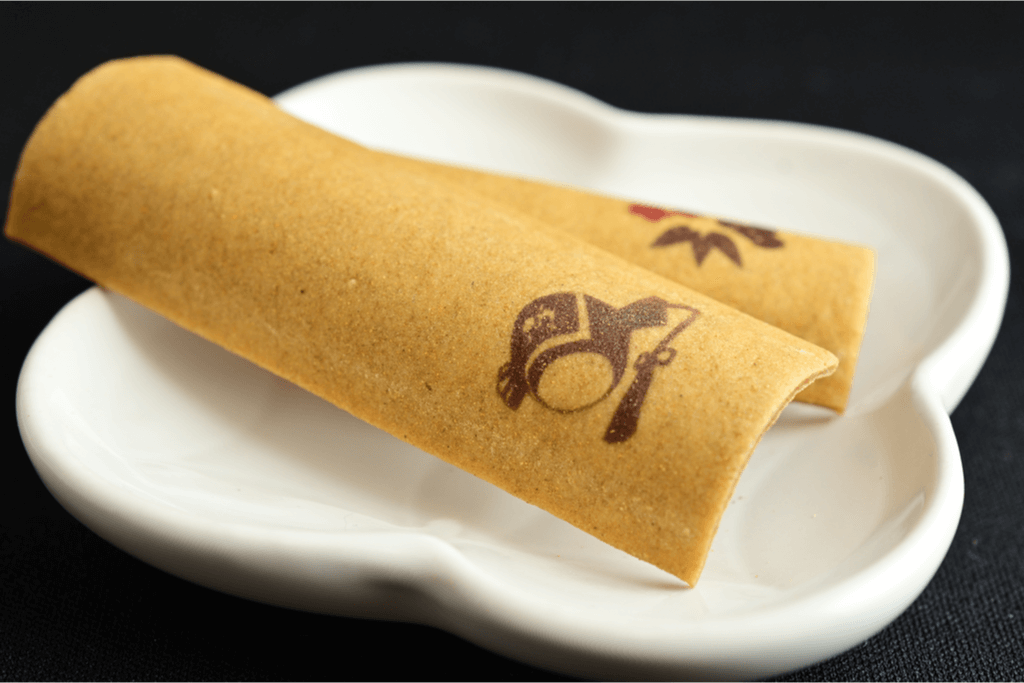 A piece of baked yatsuhashi, is on of many popular omiyage, or souvenirs from Japan.