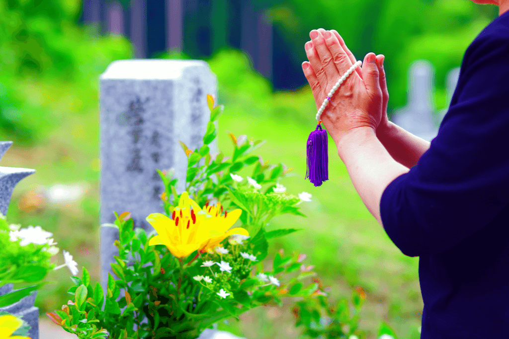 A woman prays at a Japanese funeral.