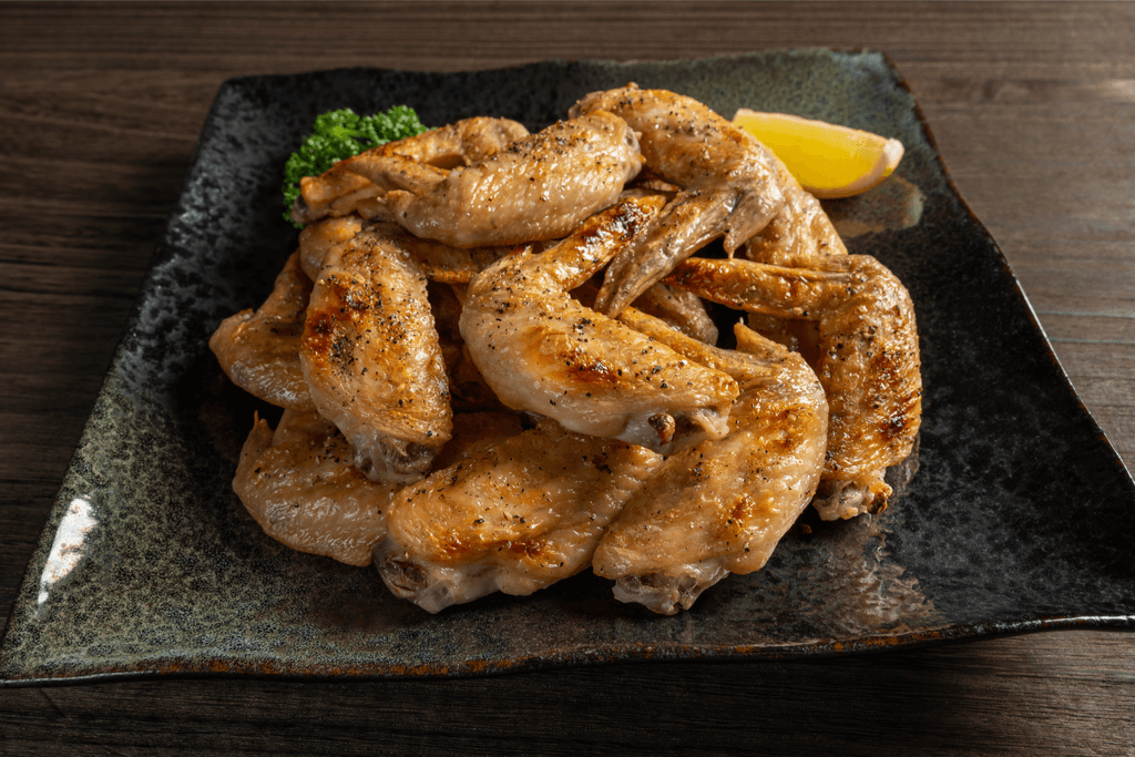 A plate of tebasaki-style fried chicken wings.