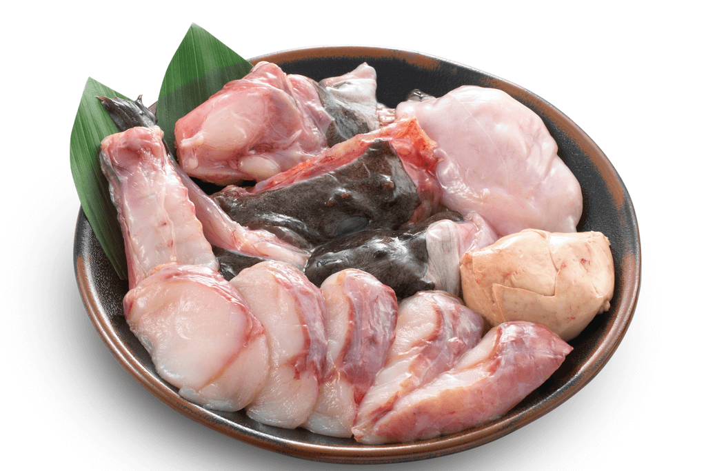 A picture of raw anko fish meat. It's very pink and light.