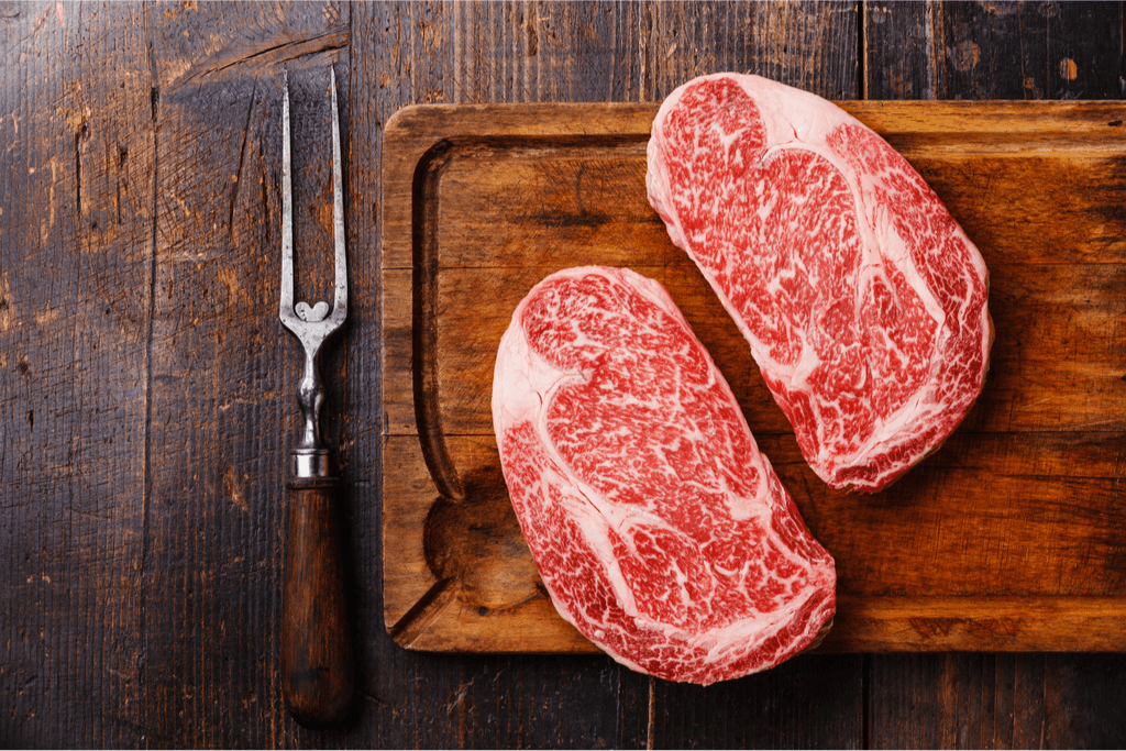 Some slices of high-quality Hitachi beef. It's red and very marbled with fat.