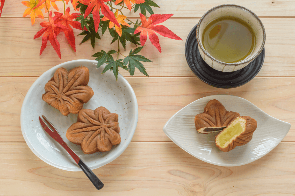 A table with momji manju. It's a sweet bun shaped like maple leaves filled with sweet bean paste.