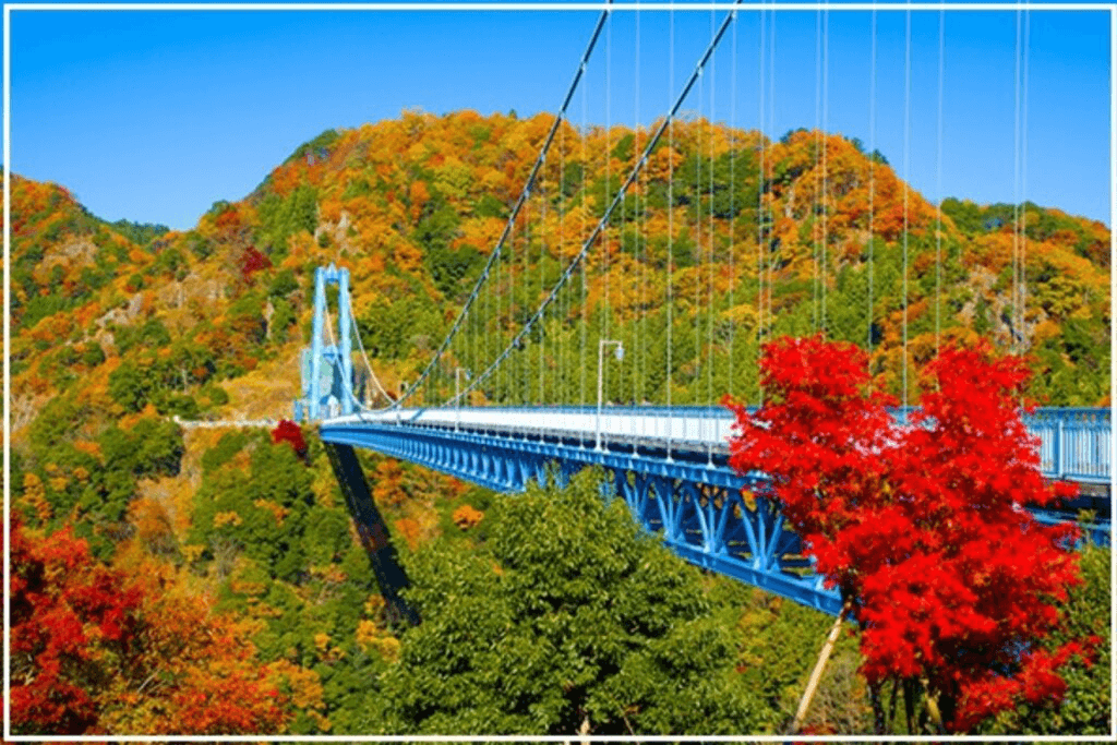 A large, white suspension bridge in the mountains. It's only 30 minutes away from Mito, Ibaraki.
