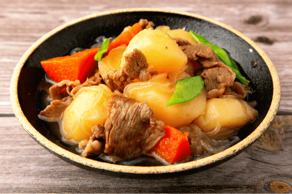 A bowl of Nikujaga, which are potatoes, beef and various vegetables. 