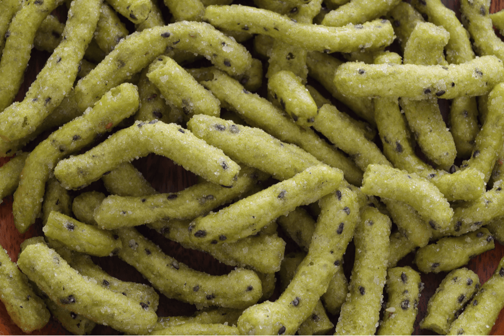 A picture of green wasabi flavored swheat sticks.