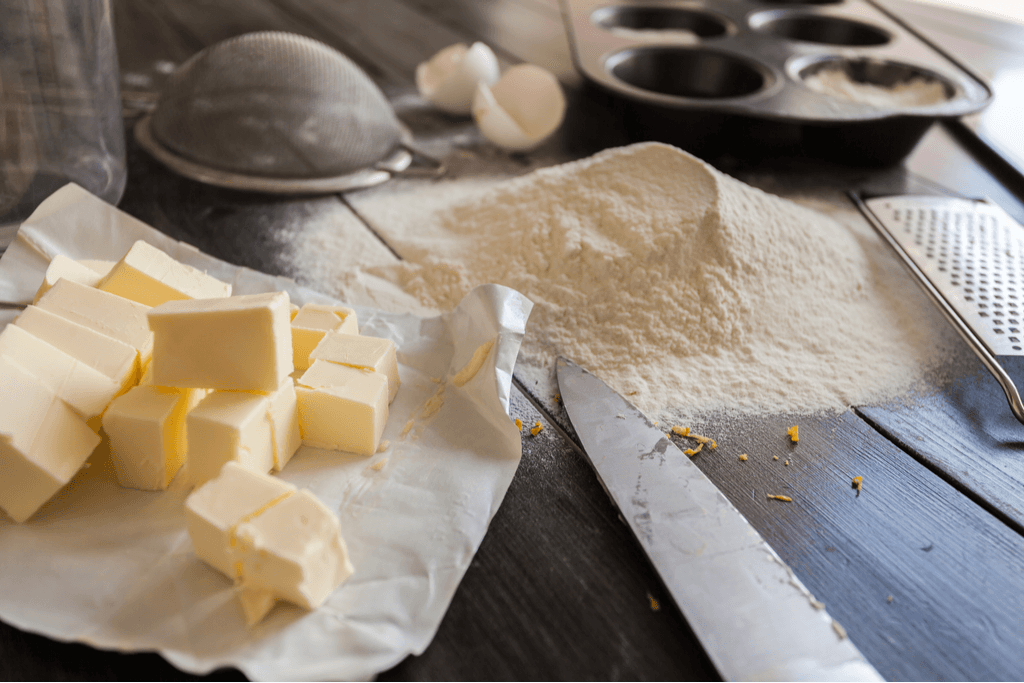 Butter, flour and other baking ingredients on a table.