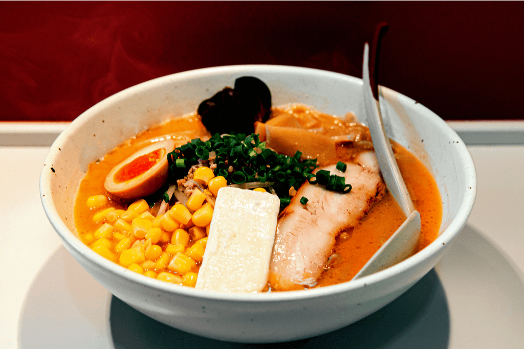 A bowl of Hokkaido butter ramen. It features corn, a miso broth and ham.