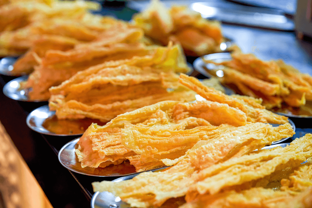 A large plate of yuba chips, which come from Japanese beans. They are thin and crunchy.