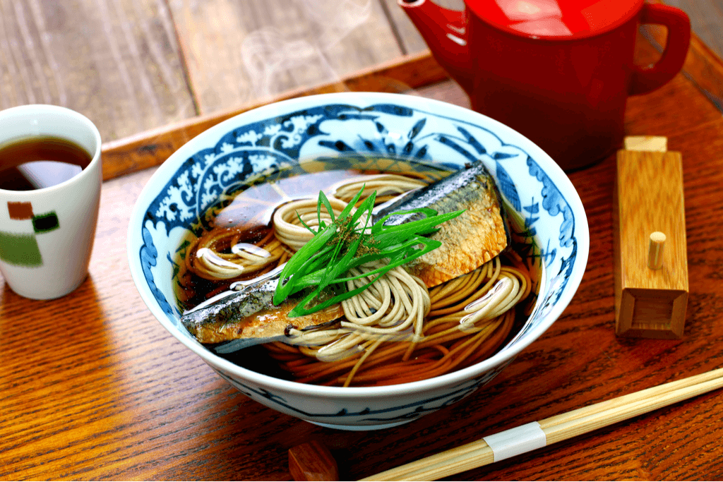 A bowl of nishin soba with herring on top.