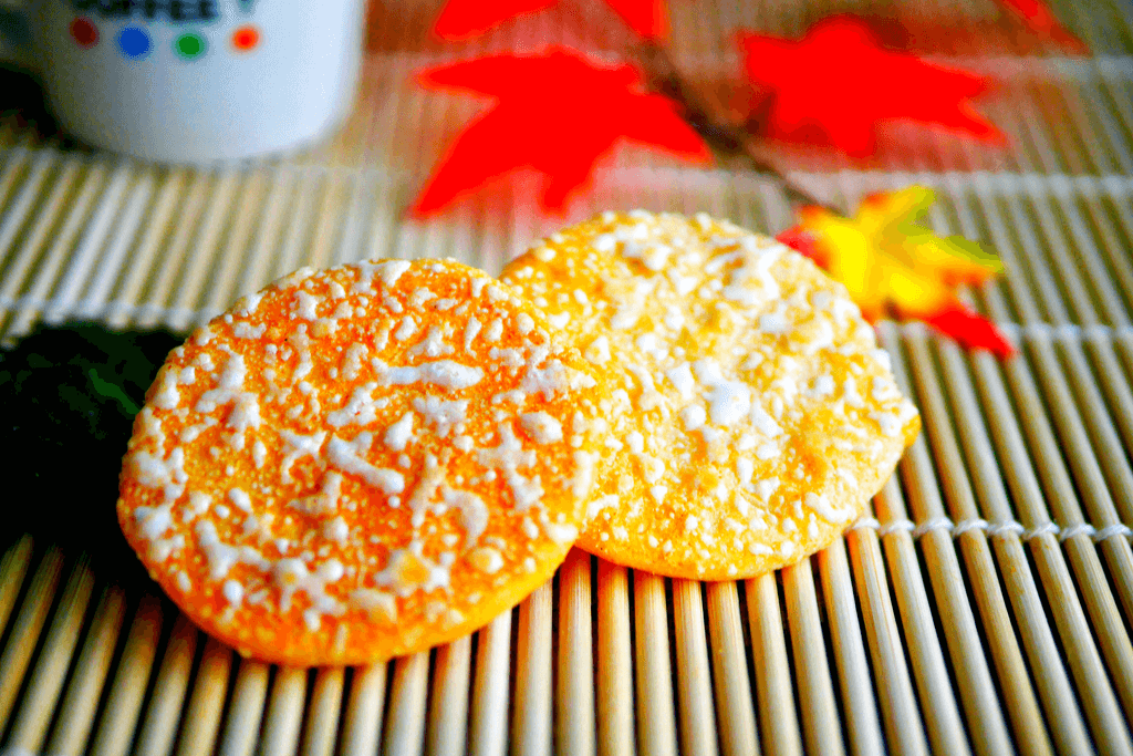 A shot of yuki no yado Japanese rice crackers with white icing on top.