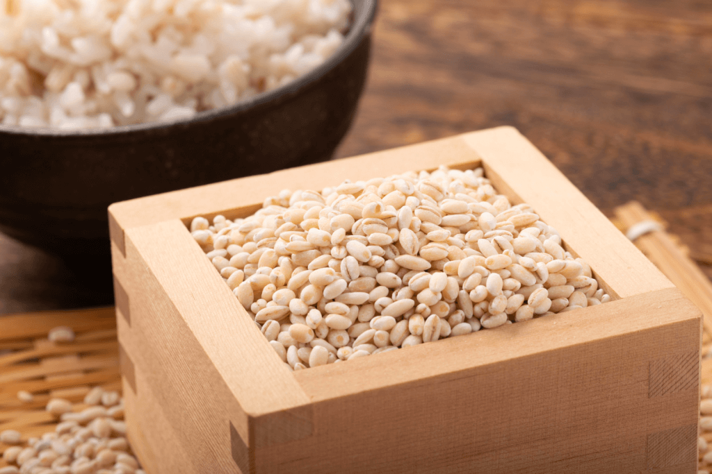 A rice storage box filled with uncooked grain.