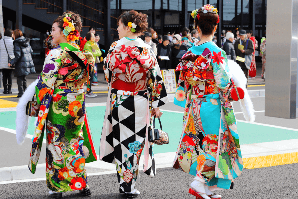 Three young women wearing colorful furisode womens kimono.
