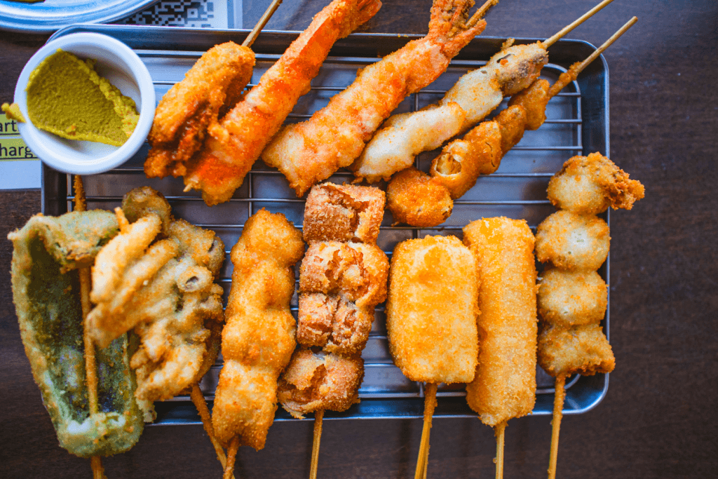A big platter of kushikatsu, which is a bunch of deep-fried meats and vegetables.