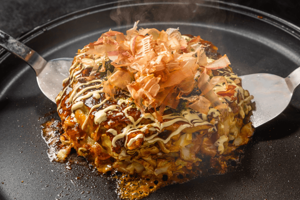 A savory pancake, or okonomiyaki on a griddle. It's just as savory as takoyaki.