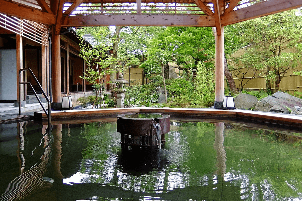 Tsukioka Onsen in Niigata with a hot spring in the forest, perfect for seasonal holidays.