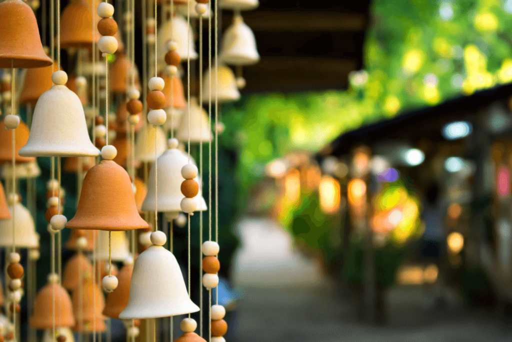 A bunch of bell-shaped ceramic wind chimes.