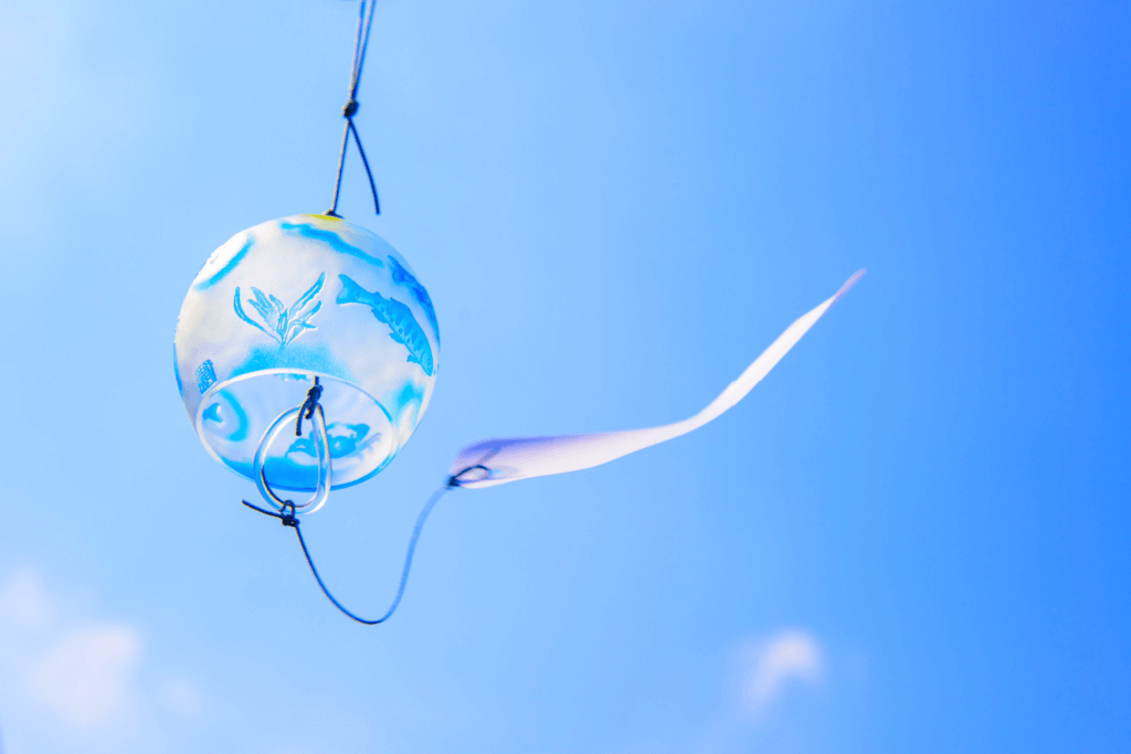 A fuurin Japanese wind chime among a blue sky.