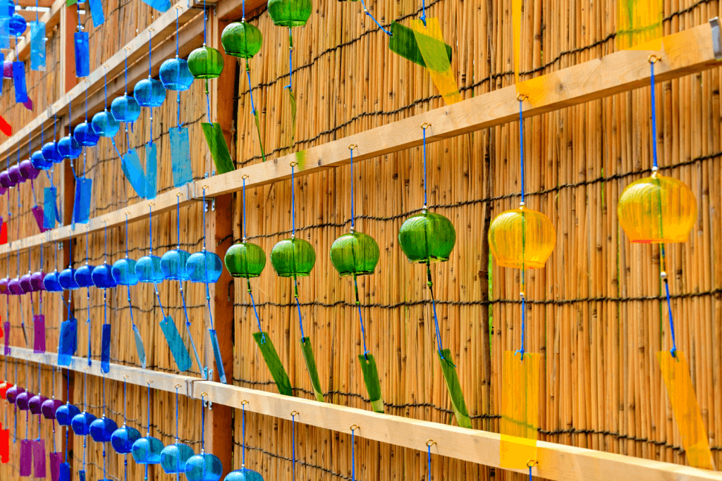 A wall of Japanese wind chimes, in the rainbow fuurin style.