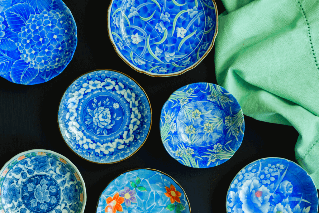 Blue and white arita ceramics in Japan. These are plates on a Japanese table. Some people use these plates while enjoying the sakura tree blossom.