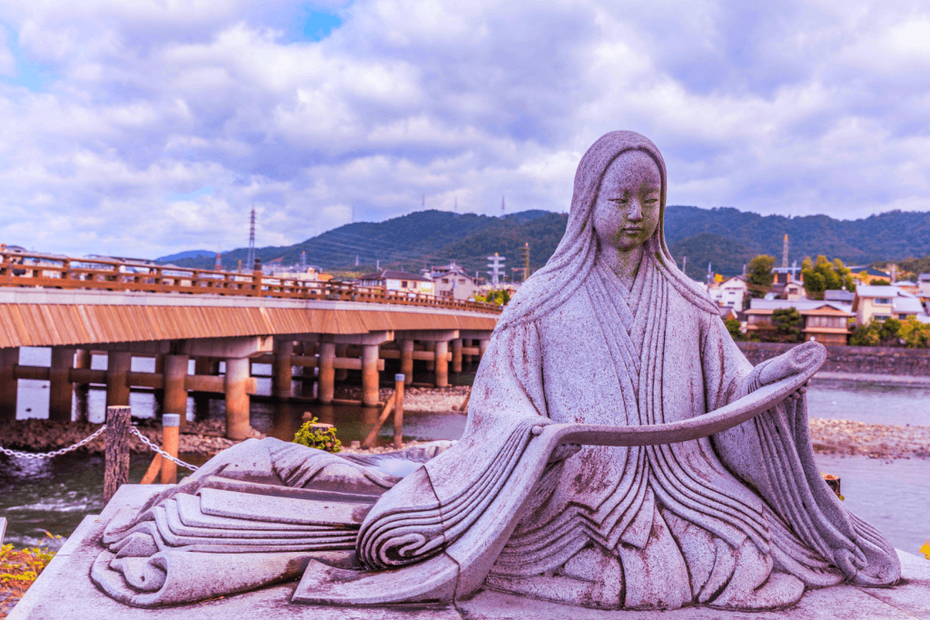 A statue of Murasaki Shikibu, dressed in an elaborate kimono.
