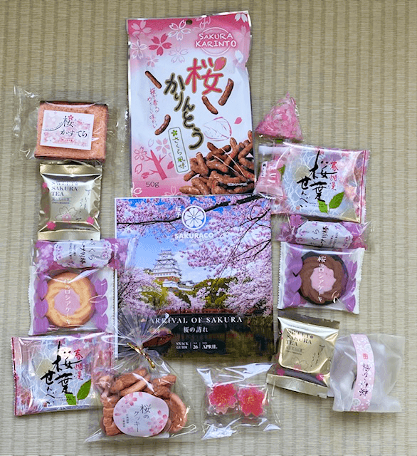 Sakuraco's booklet surrounded by sakura snacks.