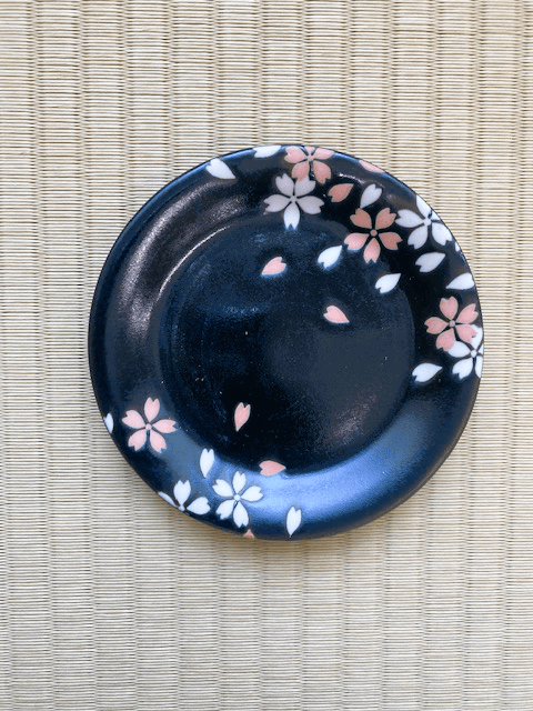 A black and pink sakura plate.