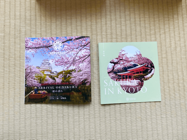 The covers of Sakuraco and Bokksu's booklets.