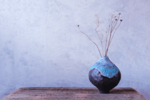 A blue and gray wabi sabi flower vase.