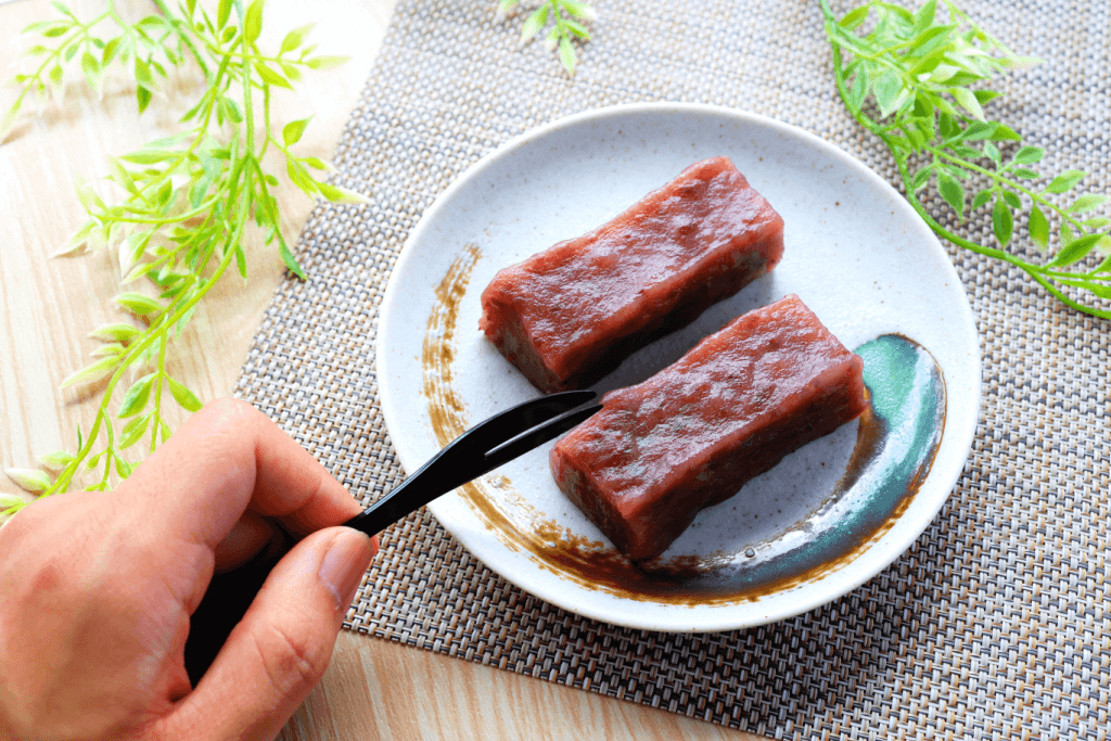 A plate of dark, red bean uiro mochi. This is another snack that people enjoy during moonlit sakura season.