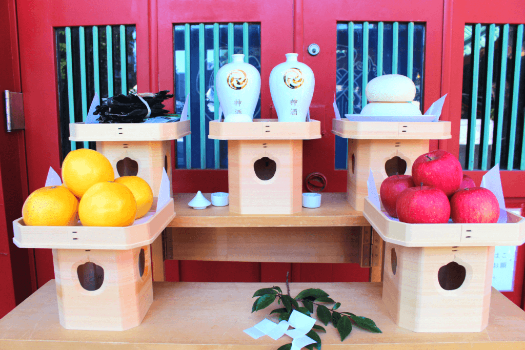 Oranges and apples presented as Buddhist offerings.