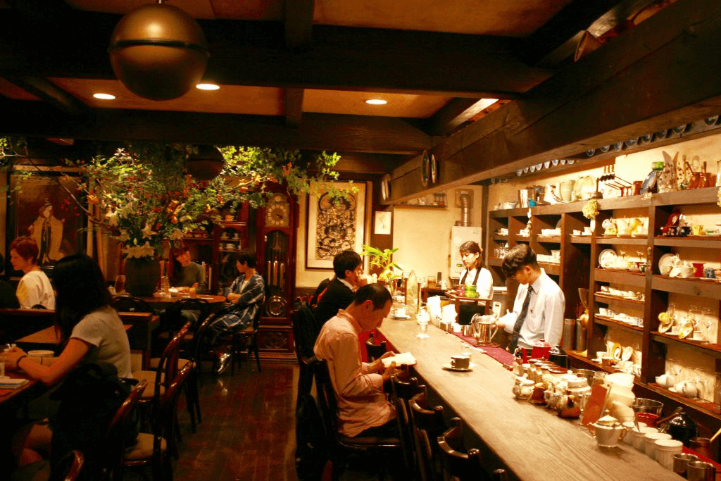 The interior of a kissaten, which has a lot of vintage decor from the early to mid Showa era.