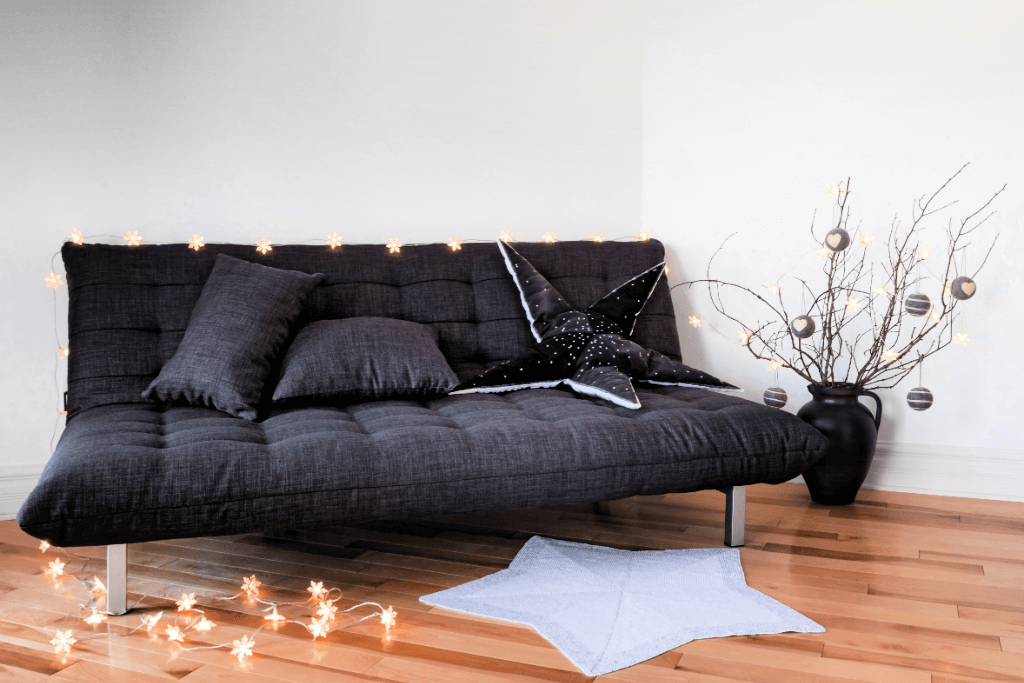 A black futon sofa bed.