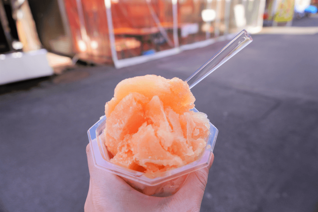 A cup of orange Hakodate ice.