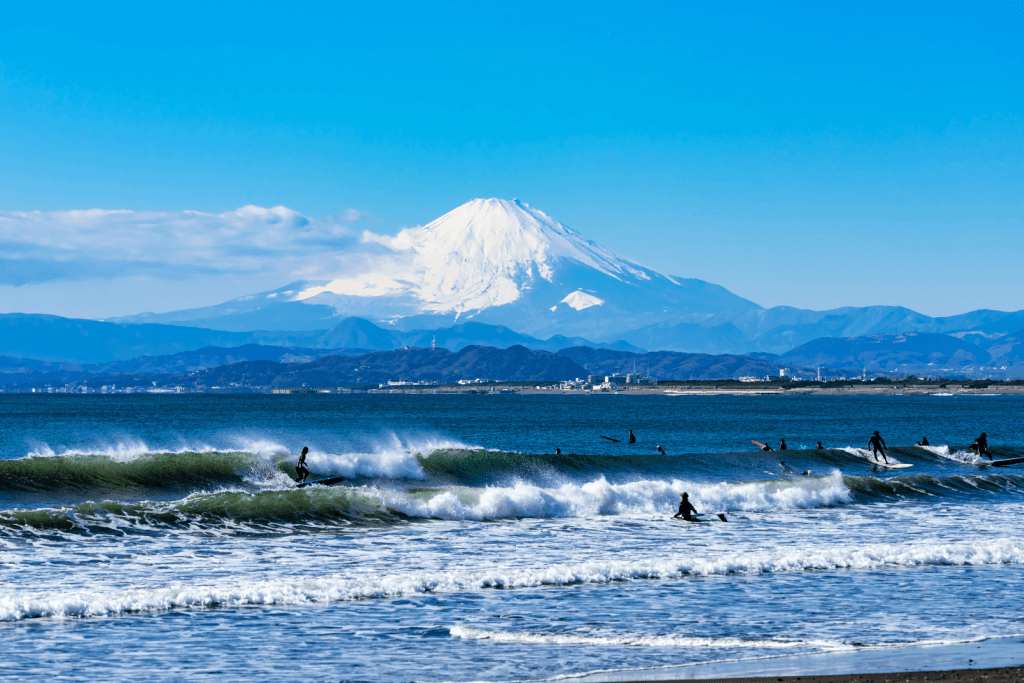 People surfing on Kamakura Beach.