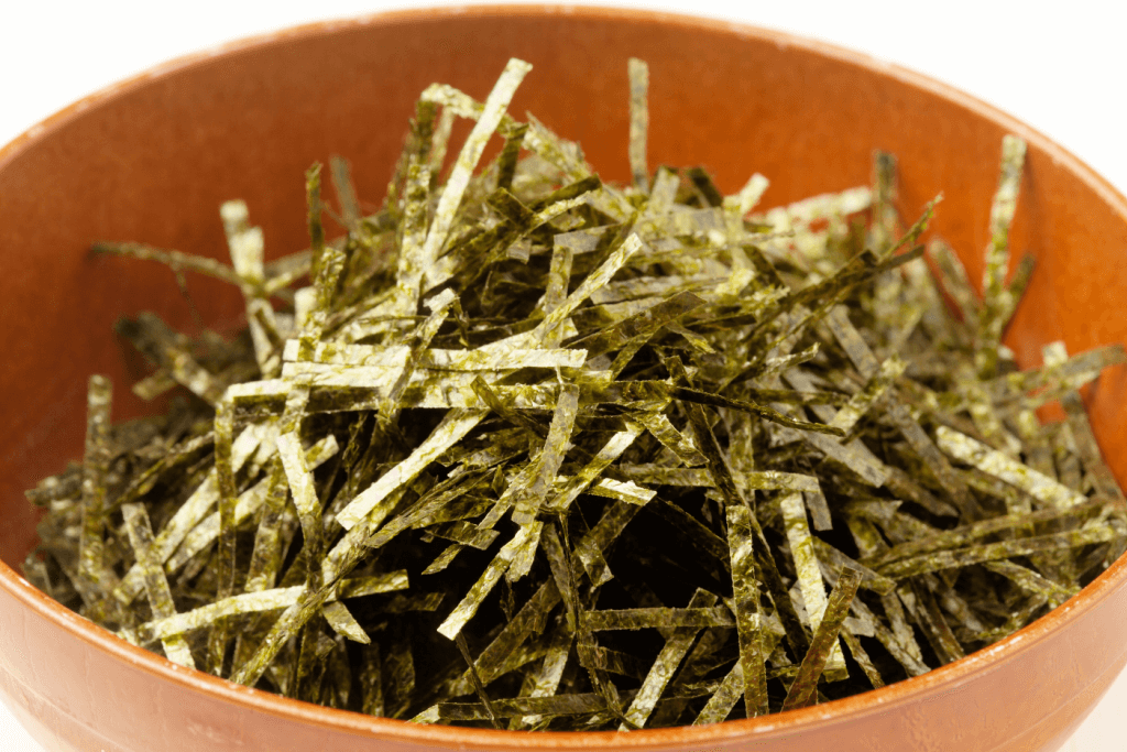 A bowl of shredded seaweed.