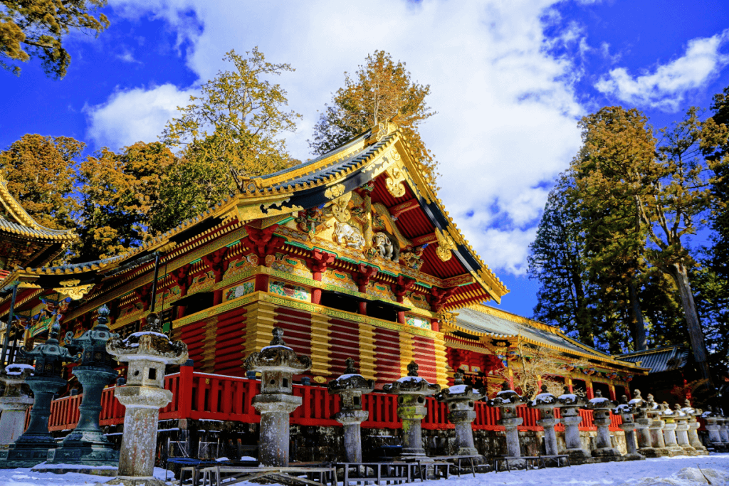 Nikko Toshogu Shrine during the daytime. It's red and gold.
