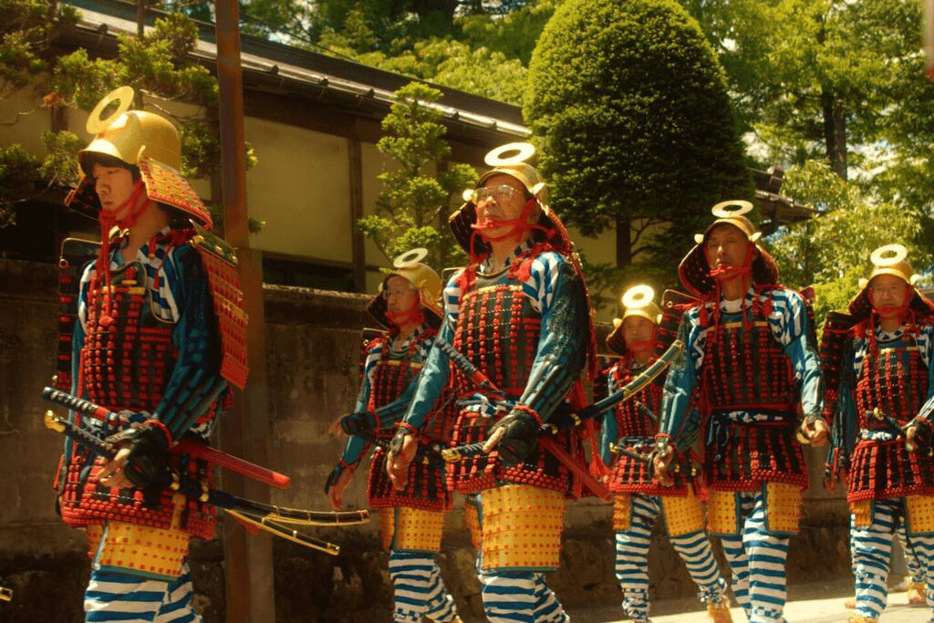 A bunch of male participants in samurai regailia, participating in the One Thousand Samurai Procession.