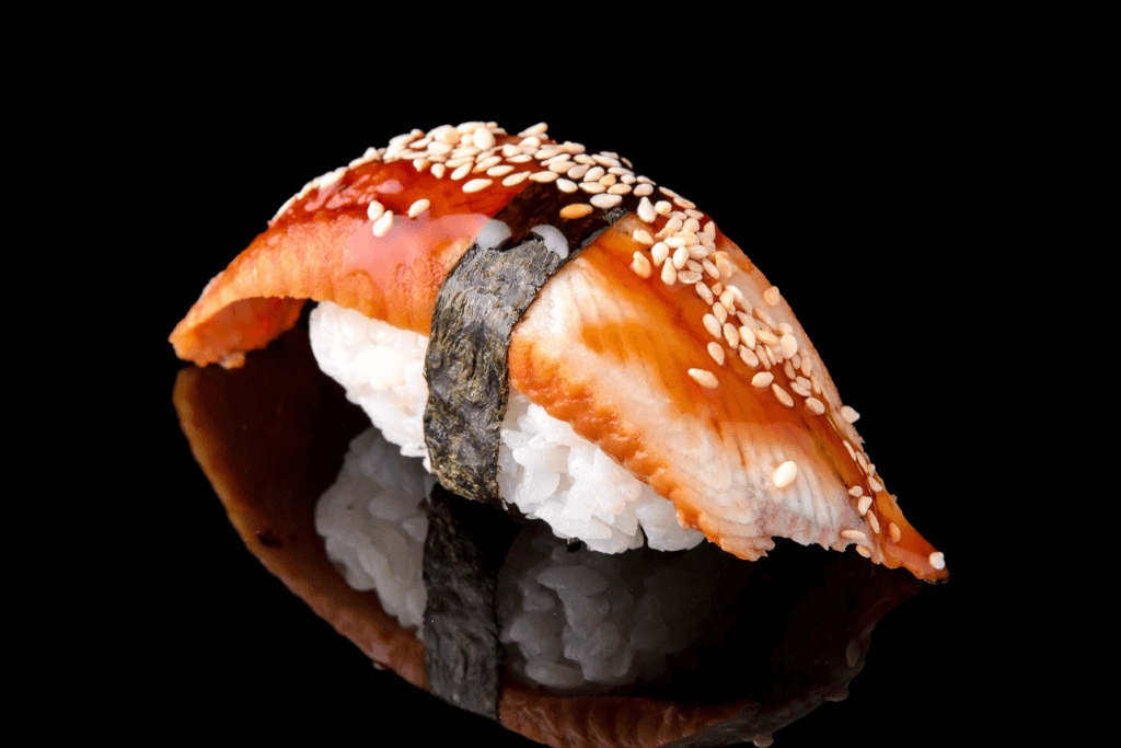 A single piece of unagi sushi.