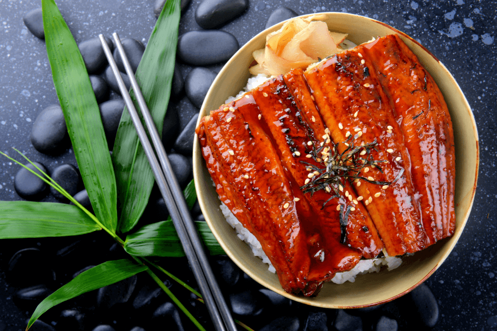 Grilled eel, smothered in sweet soy sauce, answering the question, "What is unagi".