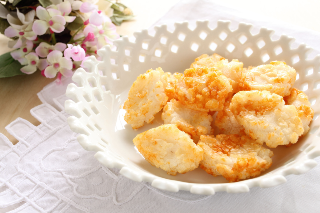 Crunchy homemade Japanese rice crackers sit in a bowl