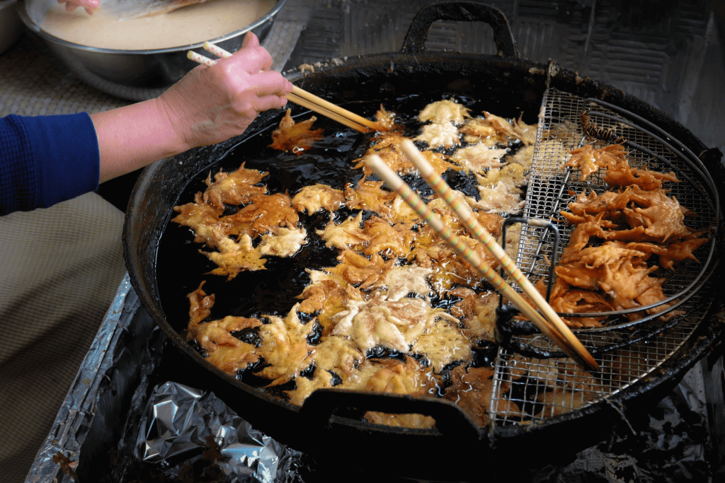 Deep fried maple leaves in a pot.